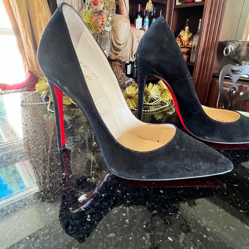 Black suede Louboos.